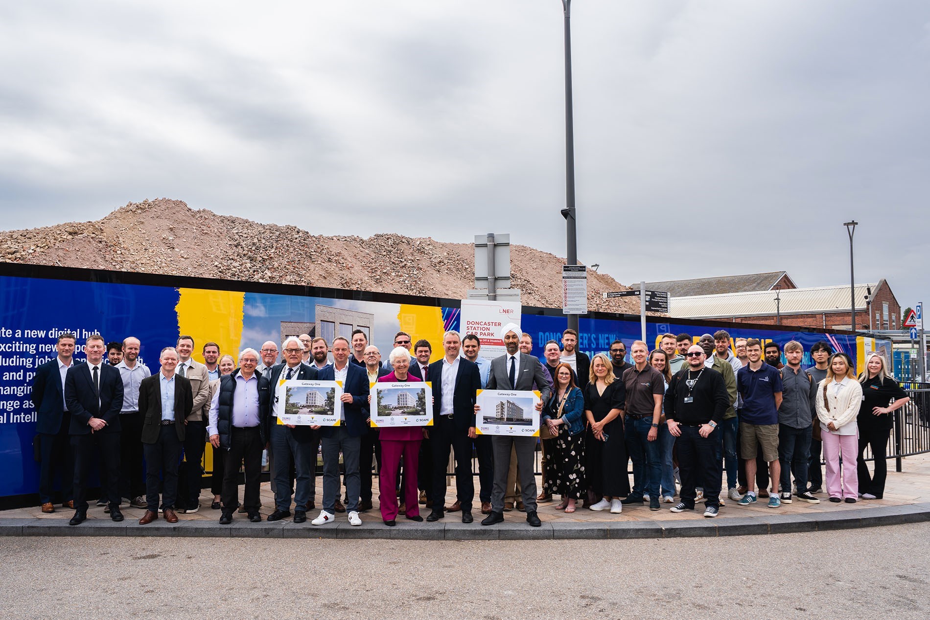 Delegates gathered at the site of Gateway One to celebrate the groundbreaking 