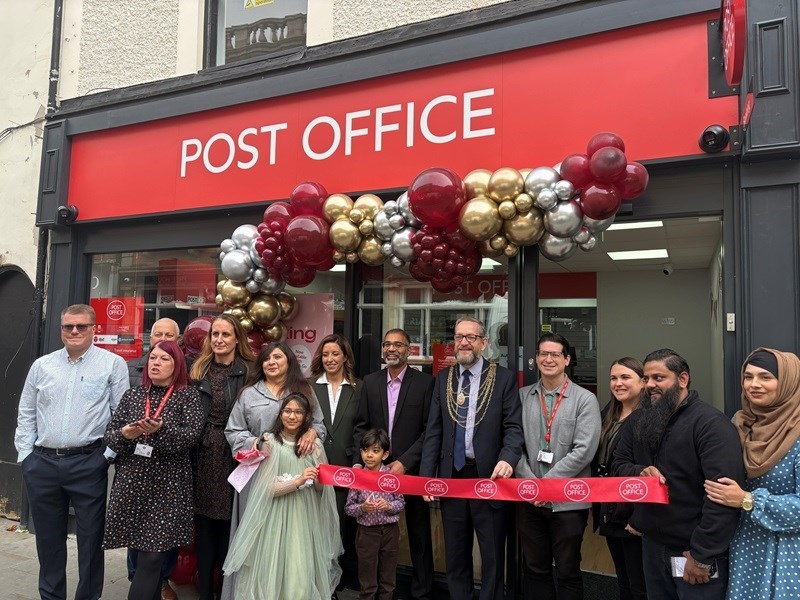 Delegates gather outside the new post office in the city centre 